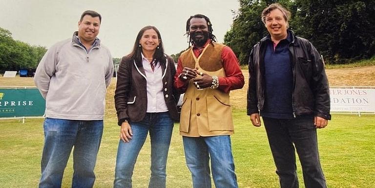 Andrew Subramaniam and Levi Roots posing for a photo in the countryside