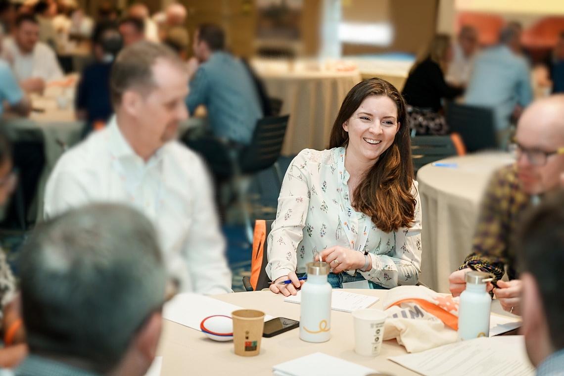 HW Fisher staff at a conference